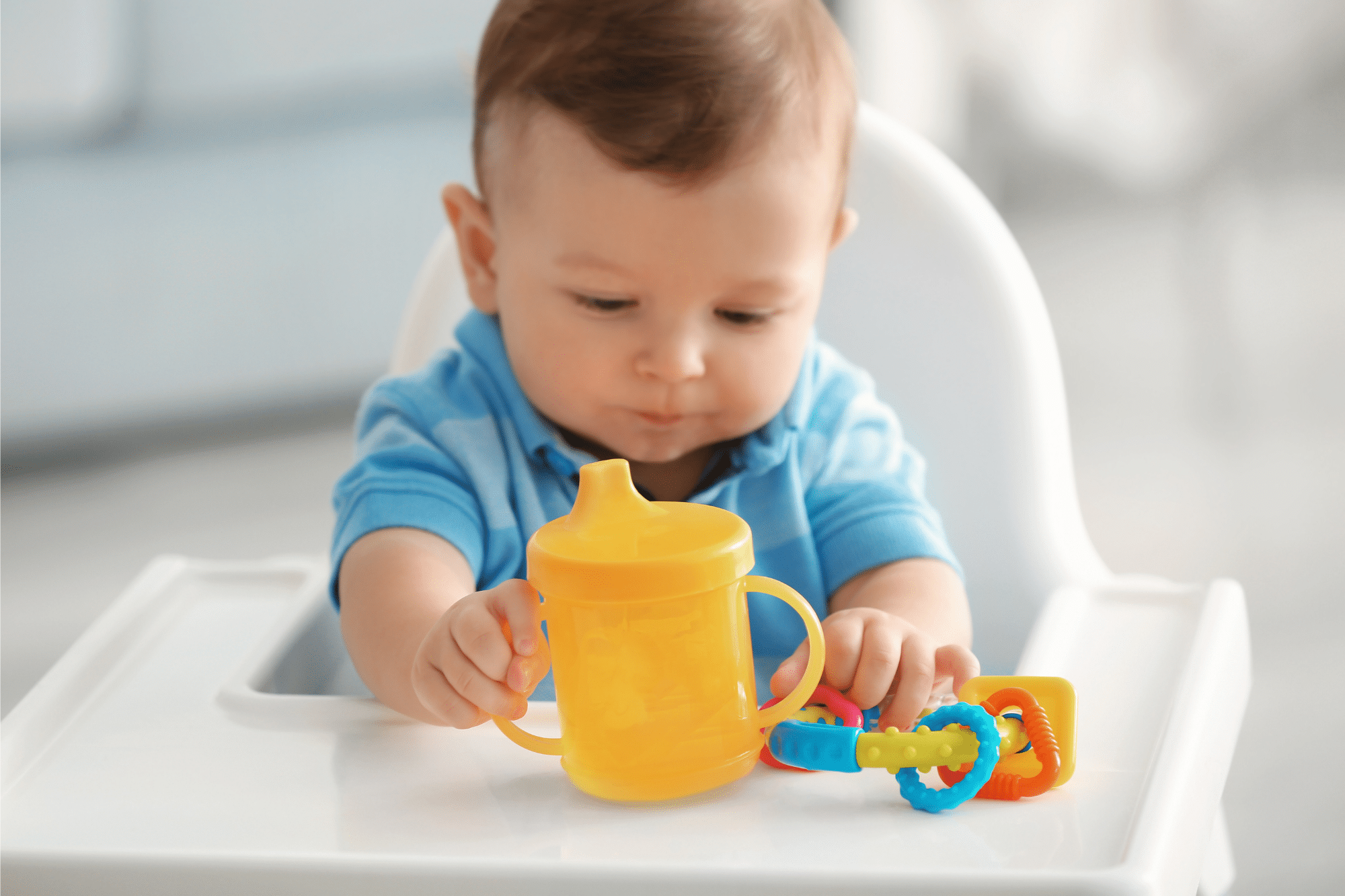 When babies can use sippy cups, and how to transition from bottle to cup